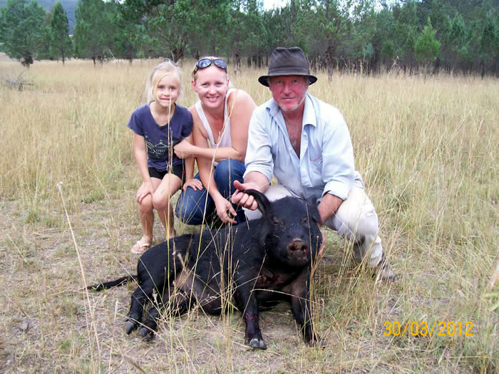 Sarah and Rod with an 80kgs sow